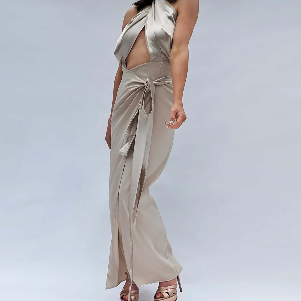 
                      
                        A demure beige satin dress elegant dress worn by a model
                      
                    