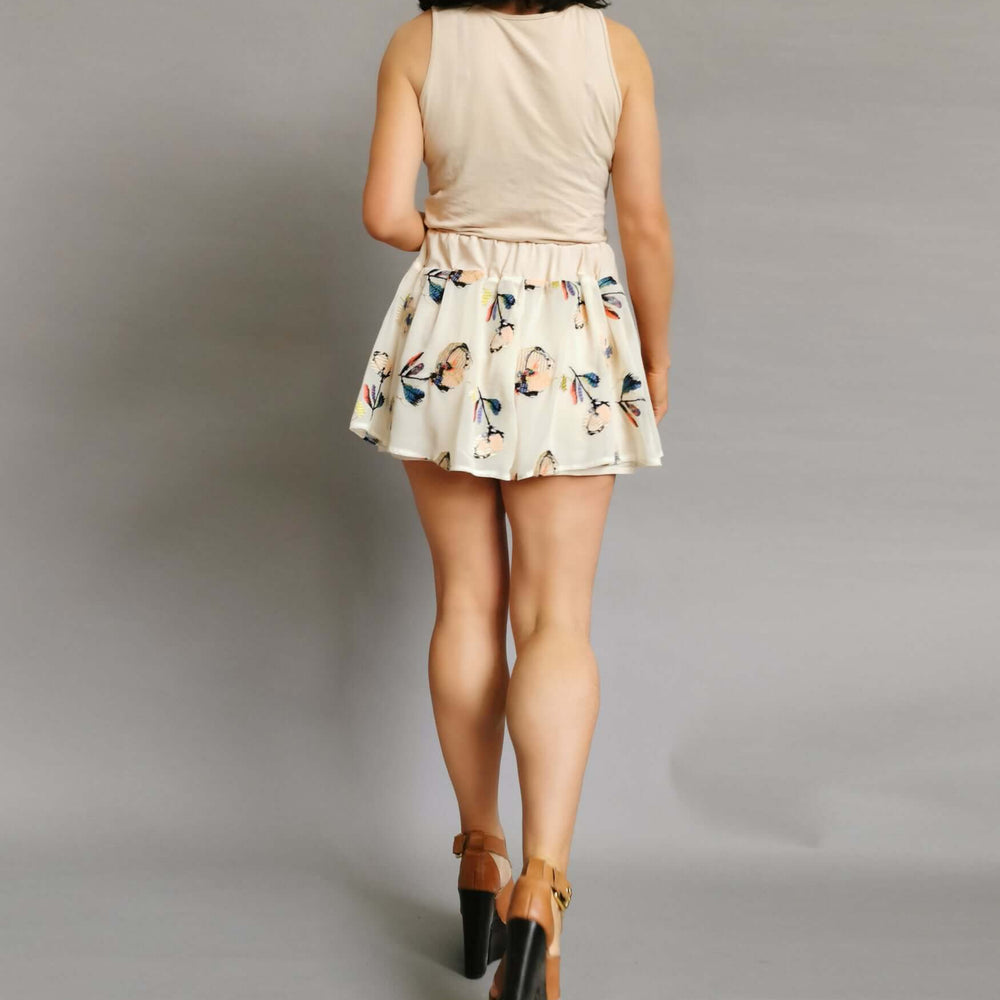 An elegant woman in a stylish shorts, exuding a sense of fashion.